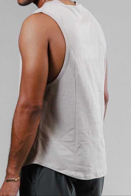 Man in athletic wear walking on a gray background